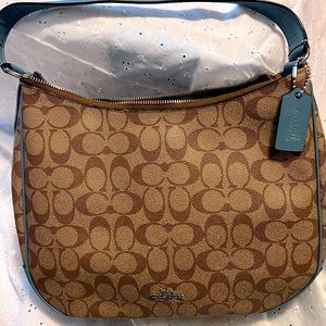 Coach shoulder carry bag , teal handle , like new great bag Signature canvas